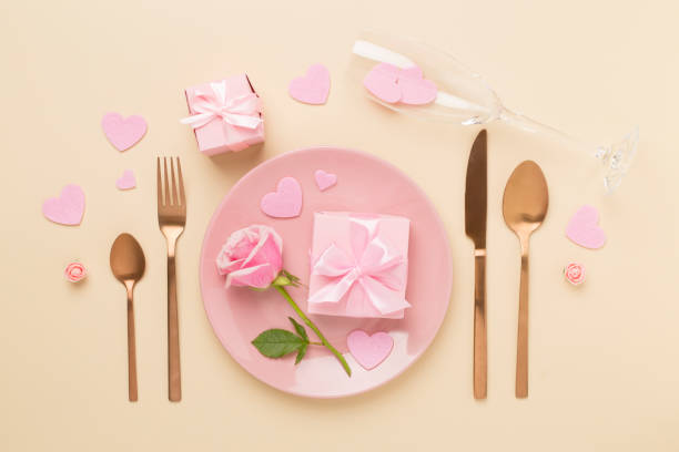 istock Festive table setting for Valentine's Day on color background, top view 2191683028