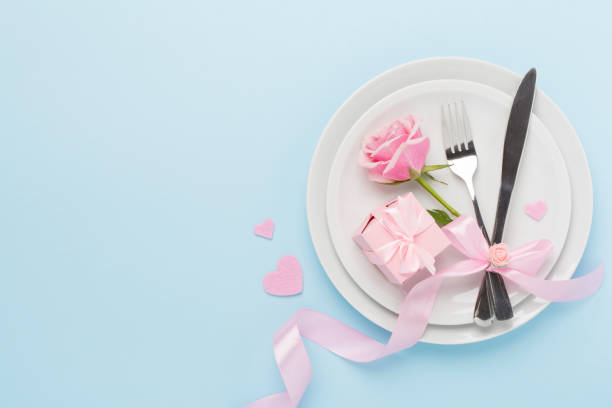 istock Festive table setting for Valentine's Day on color background, top view 2191683029