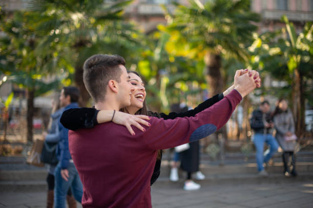 istock Young couple dancing outdoors in a city square 2191683275