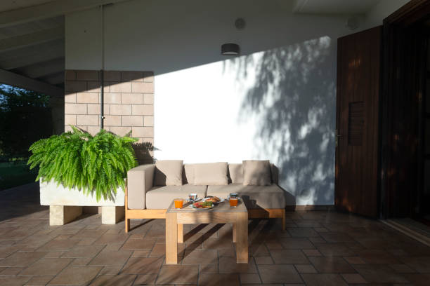 istock A cozy patio with a comfy couch and a chic coffee table 2191683675