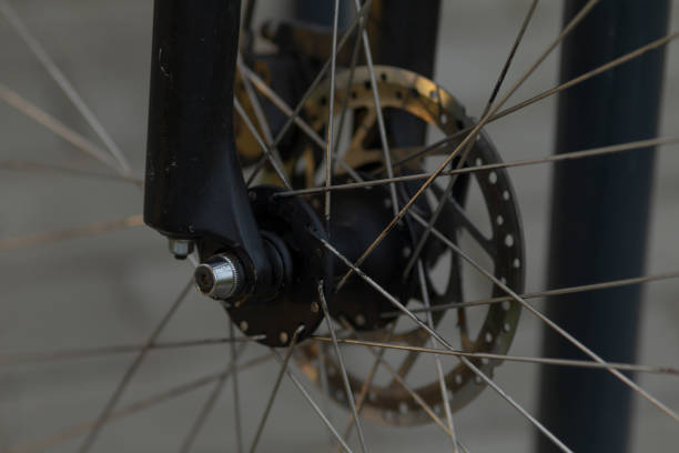 istock Closeup of the Bicycles Front Wheel Hub and Disc Brake Assembly features 2191683914