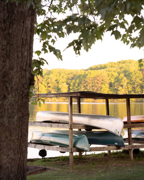 istock Canoes stored by the Lake 2191685836