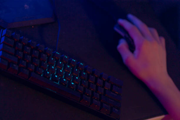 istock A Gaming Setup featuring a Keyboard and Mouse positioned on a Dark Background 2191686040