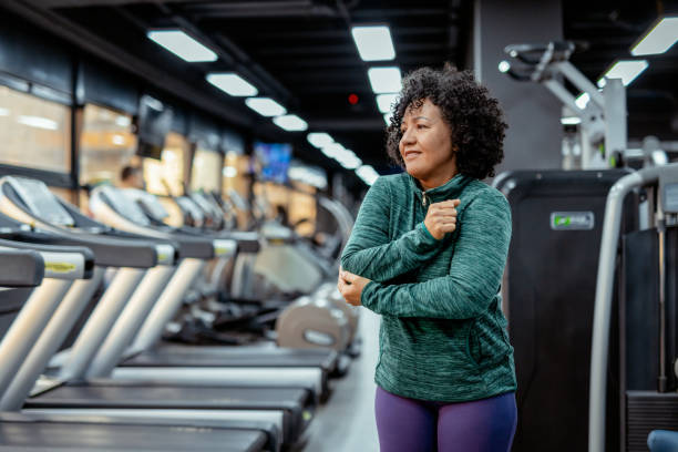 istock Fitness Injury: Woman Holding Her Elbow in Discomfort 2191686838