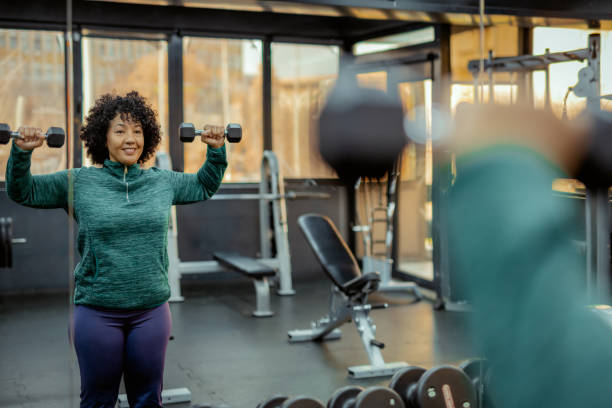 istock Woman Engaged in Dumbbell Training at a Modern Gym 2191686981