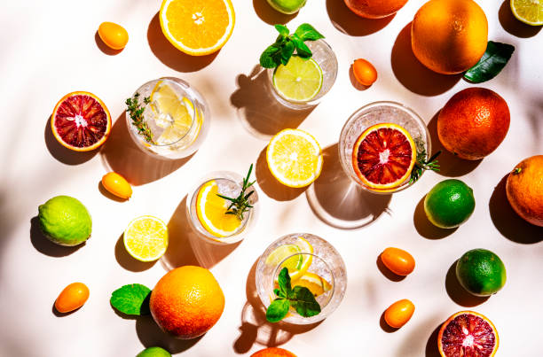 istock Gin and citrus cocktails, top view. Beige background, hard light, shadow pattern, top view 2191689955