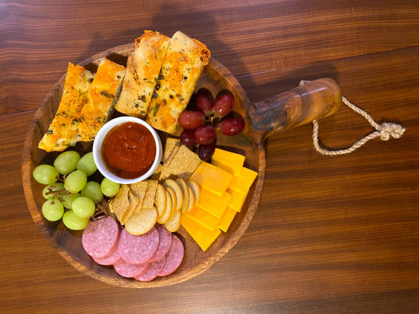 Holiday Charcuterie Board filled with Focaccia, meat & cheese.