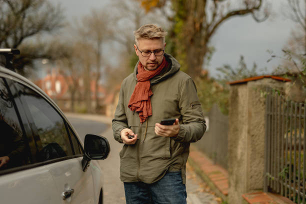 istock Young Attractive Man With A Car On A Street 2191693891