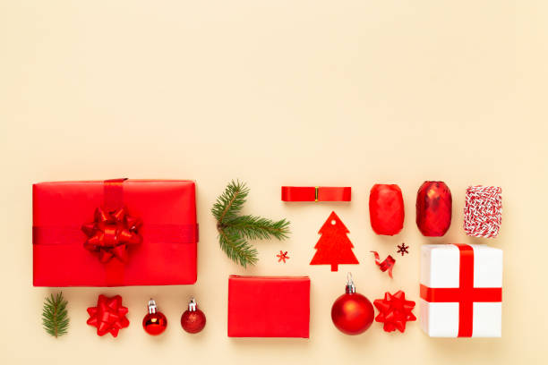 istock Handmade wrapped christmas gift boxes with stuff on color background, top view 2191694775