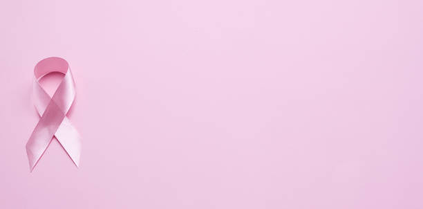 istock pink ribbon breast cancer on pink background. with copy space 2191695071