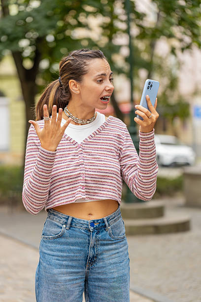 istock Angry mad stressed woman arguing while talking on smartphone conversation irritated shout quarrel 2191702783