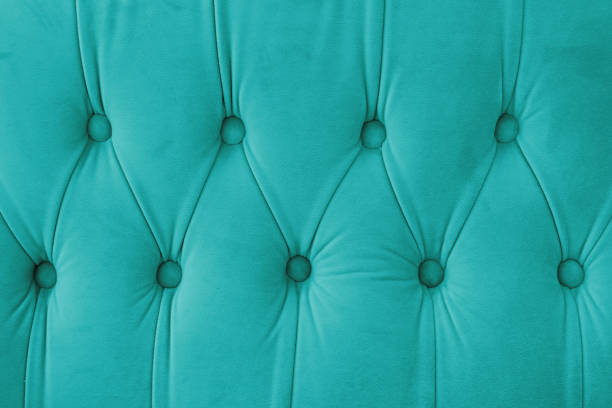 istock Capitone, Chesterfield style suede fabric texture, turquoise diamond buttoned turquoise background 2191702896