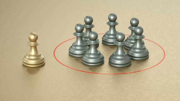 istock 3D render, gold pawn, silver pawns, red circle, isolation, leadership concept, strategy, teamwork, metallic texture, beige background, minimalist composition, contrast, group dynamics. 2191708126