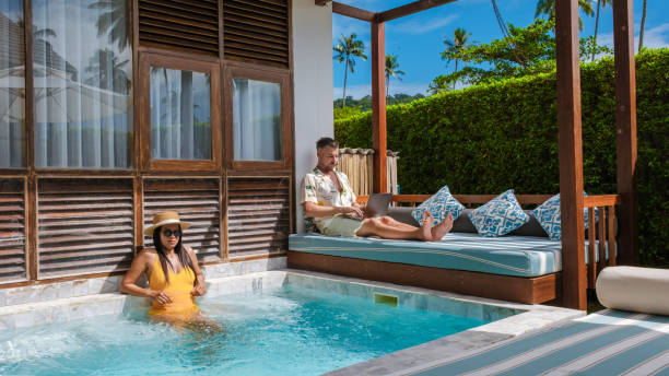 istock Freelancer enjoying time at a pool villa while working remotely in Thailand 2191711636