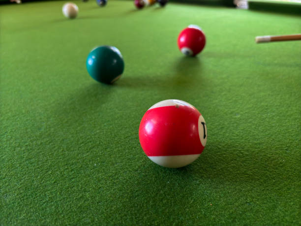 istock A red and white ball sits on a green pool table 2191711933
