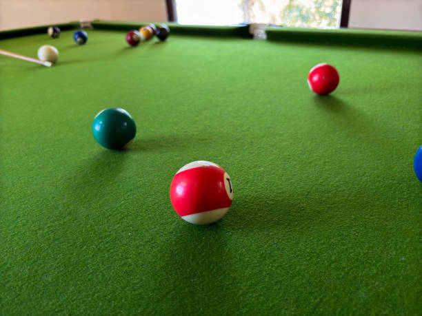 istock A red and white ball sits on a green pool table 2191711943