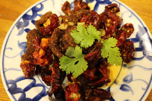 istock Sichuan cuisine (Chinese cuisine): fried beef and chili peppers with coriander 2191715806