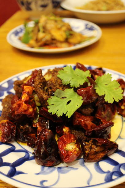 istock Sichuan cuisine (Chinese cuisine): fried beef and chili peppers with coriander 2191715811