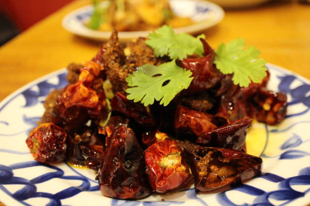istock Sichuan cuisine (Chinese cuisine): fried beef and chili peppers with coriander 2191715813
