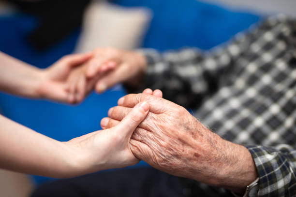 istock Close-Up of Elderly Hands with Supportive Younger 2191719588