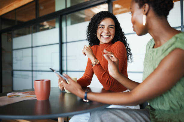 istock Laughing Collaboration: Two Women Sharing Ideas 2191721068