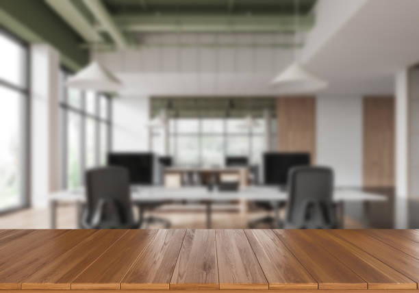 istock Wooden countertop against a blurred modern office background for product display or presentation mockup. 3D Rendering 2191724672