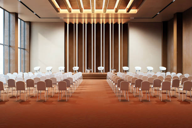 istock Modern conference hall interior with empty seats and stage for events, featuring backlit walls, spacious layout, and contemporary design. 3D Rendering 2191725693