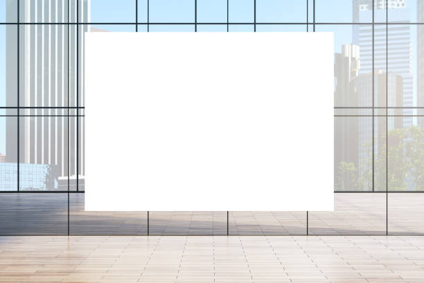 istock Blank white vertical display in modern glass-walled interior with cityscape view in the background, open and spacious design. 3D Rendering 2191726201