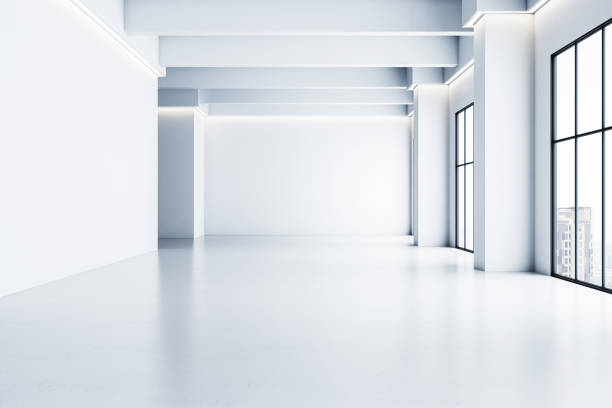 istock Minimalist empty interior gallery with white walls, clean floor, and large windows, illuminated by soft light. 3D Rendering 2191726304