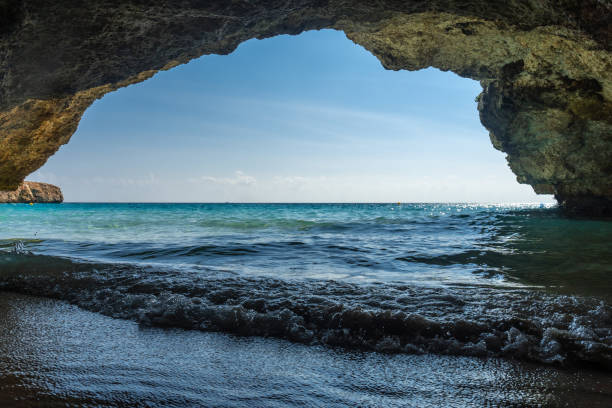 istock Waves crashing on shore in cala domingos, mallorca, spain, view from inside a cave 2191726348