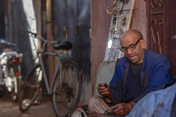 Marrakech, Marocco - February 22, 2024: man at work in one of the souks in central Marrakech