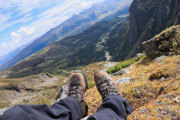 istock Hiker wearing leather hiking boots on high altitude mountains 2191728465