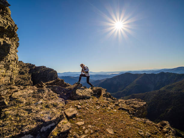 istock Athlete backlit jumping between cliffs in the mountains. Sierra de Francia. Spain 2191728476