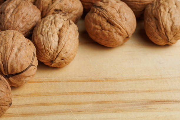 Blank price board with Hazelnuts and walnuts in wooden boxes.