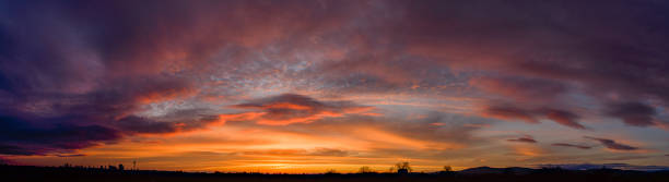 istock Atmospheric sunrise or sunset with orange-coloured clouds on the horizon 2191729396