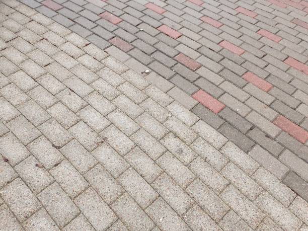istock Pedestrian path made of tiles of different colors 2191730220