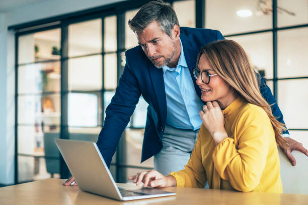 istock Two business coworkers talking 2191730473