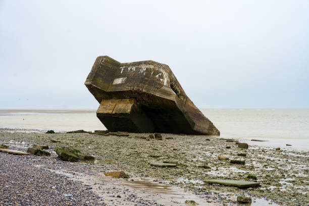 istock Unique concrete structure rests on a rocky beach under overcast skies along the coastline 2191730531