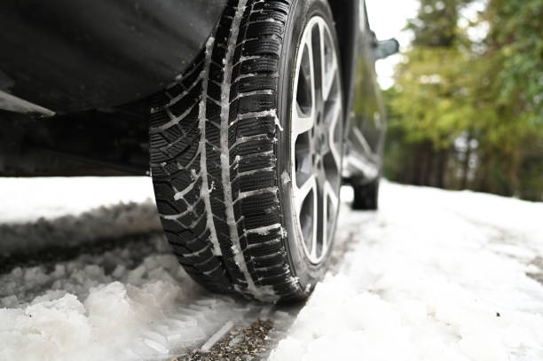 istock tires drives through a snow-covered road 2191731236