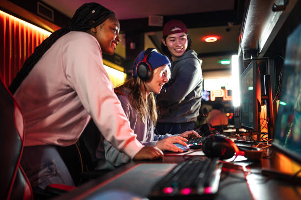 istock Multiethnic group of young friends playing video games 2191735049