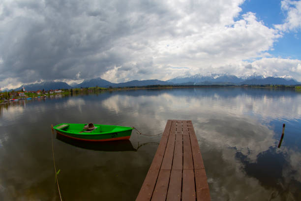 Image of a red boat by the lake