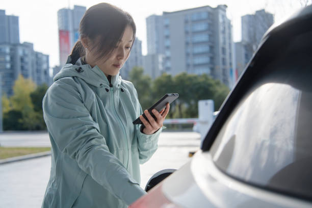 istock Asian women using smart phone in  at the charging station. 2191736652