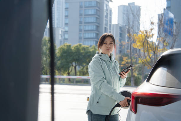 istock Asian women using smart phone in  at the charging station. 2191736654