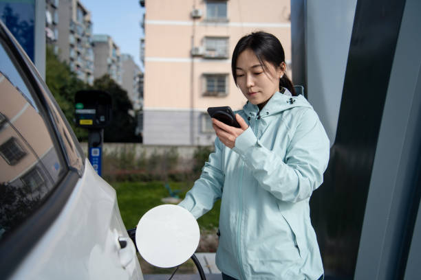 istock Asian women using smart phone in  at the charging station. 2191736873