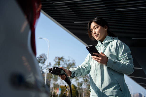 istock Asian women using smart phone in  at the charging station. 2191737055