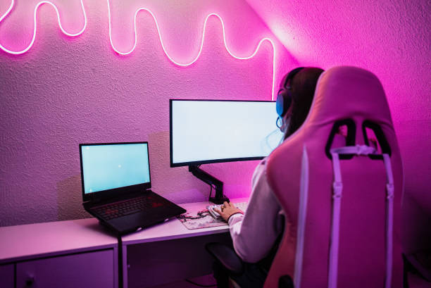 istock Woman playing game on a computer at home 2191737935