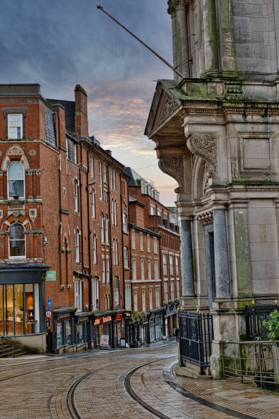 istock Brick Buildings and Stone Structure at Street Intersection with Tram Tracks in Birmingham, UK. 2191738269