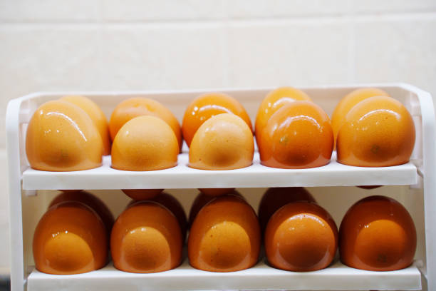 Clean wet eggs are placed on a shelf in the refrigerator. convenient storage of products.
