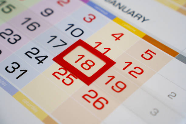 the red frame on eighteen on the calendar sheet. Appointment scheduling. anticipation of an important event or holiday.