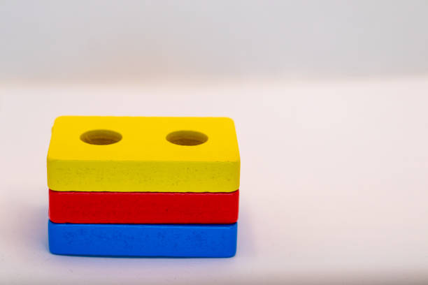 istock Stacked Wooden Blocks: Yellow, Red, Blue 2191739326